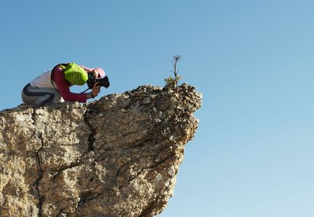 Young photographer in the mountainの写真素材