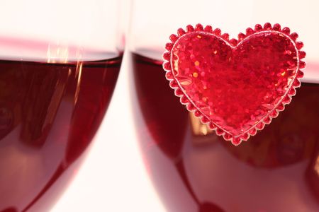 Two Wineglasses and heard on windowの写真素材