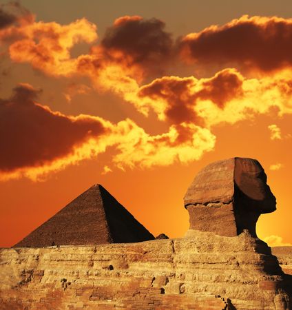 Egyptian sphinx and pyramid on sunsetの写真素材