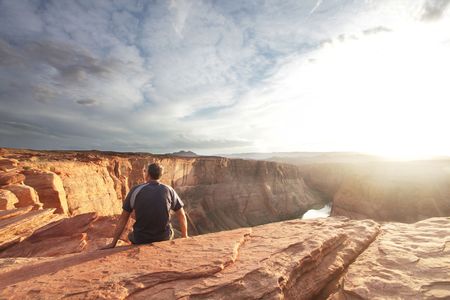 Male stand on the rockの写真素材