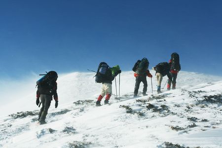 Hike in winter mountainsの写真素材