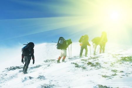 Hike in winter mountainsの写真素材