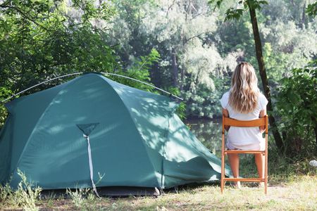 Tent in summer forestの写真素材
