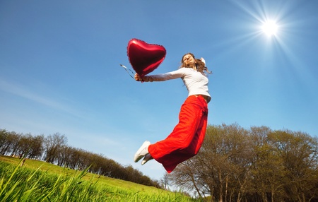 Happy girl on grasslandの写真素材