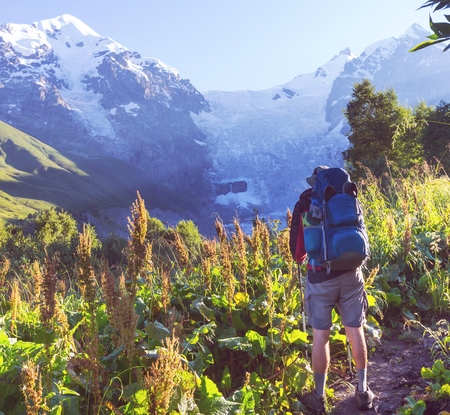 Backpacker in mountainsの写真素材