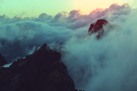 Beautiful sunset on the hill above cloudsの写真素材