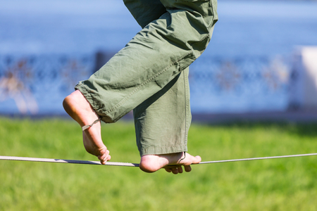 Slacklining is a practice in balanceの写真素材
