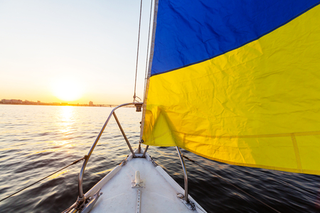 Sailing yacht on big riverの写真素材