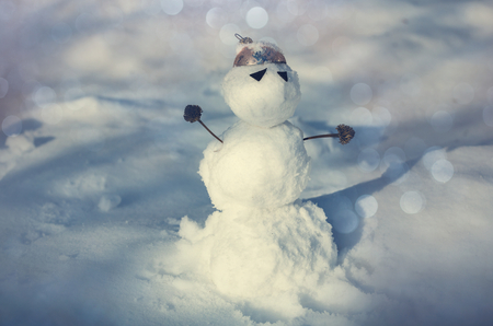 Snowman in winter backgroundの写真素材