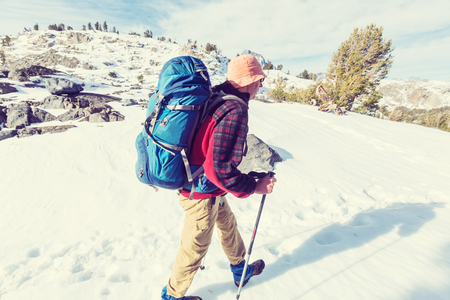 Man with hiking equipment walking in Sierra Nevada  mountains,California,USAの写真素材