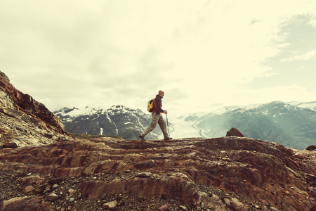 Hiking man in Canadian mountains. Hike is the popular recreation activity in North America. There are a lot of picturesque trails.の写真素材
