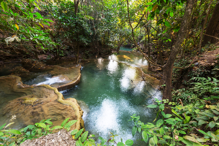 Beautiful waterfall in rainforest, Kanchanaburi province, Southeast asia, Thailandの写真素材