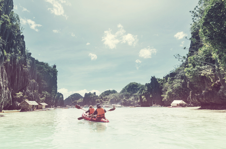 Kayak in the island lagoon between mountains. Kayaking journey in El Nido, Palawan, Philippines.の写真素材
