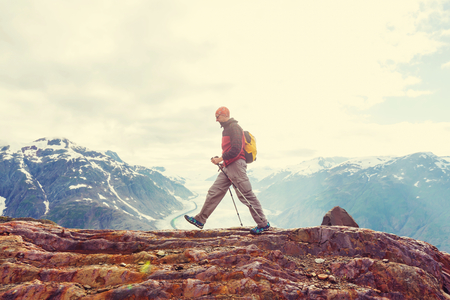 Hiking man in Canadian mountains. Hike is the popular recreation activity in North America. There are a lot of picturesque trails.の写真素材