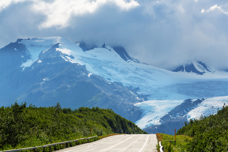 Picturesque Mountains of Alaska in summer. Snow covered massifs, glaciers and rocky peaks.の写真素材