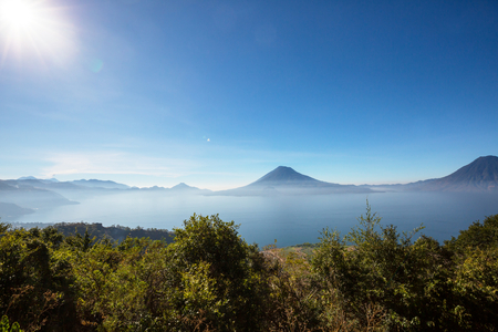 Beautiful lake Atitlan and volcanos in the highlands of Guatemala, Central Americaの写真素材