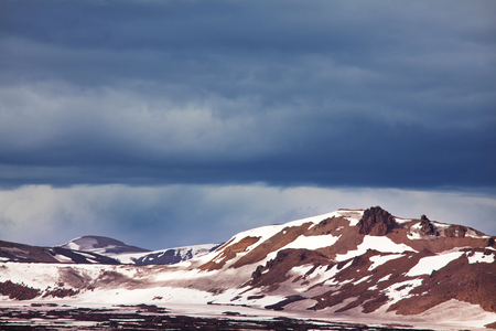 Beautiful Icelandic landscape. Green volcanic mountains in cloudy weather.の写真素材