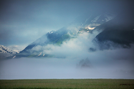 Picturesque Mountains of Alaska in summer. Snow covered massifs, glaciers and rocky peaks.の写真素材