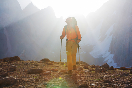 Wanderlust time. Man hiking in beautiful Fann mountains in Pamir, Tajikistan. Central Asia.の写真素材