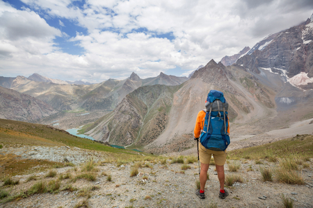 Wanderlust time. Man hiking in beautiful Fann mountains in Pamir, Tajikistan. Central Asia.の写真素材