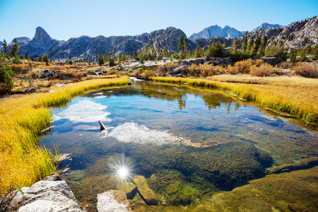 Beautiful nature scene in autumn mountains. Sierra Nevada lake reflection.の写真素材