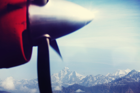 View of Himalaya mountains through an aircraft window.の写真素材
