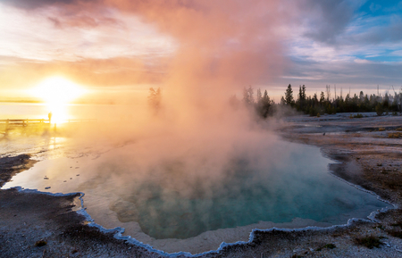 Wooden boardwalk along geyser fields  in Yellowstone National Park, USAの写真素材