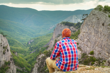 Backpacker in the summer mountainsの写真素材