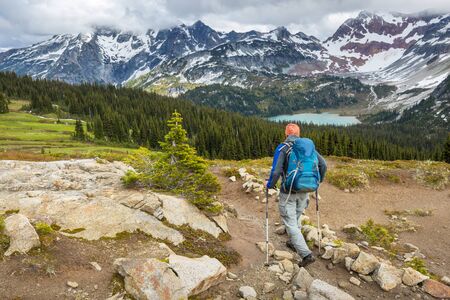Backpacker in hike in the autumn mountainsの写真素材