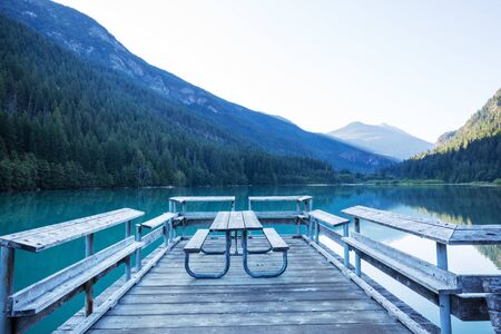 Wooden pier in serenity mountains lakeの写真素材