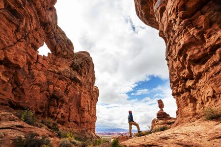 Hike in the Utah mountains. Hiking in unusual natural landscapes. Fantastic forms sandstone formations.の写真素材