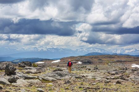 Hiking man in Canadian mountains. Hike is the popular recreation activity in North America. There are a lot of picturesque trails.の写真素材