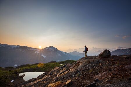 Hiking man in Canadian mountains. Hike is the popular recreation activity in North America. There...