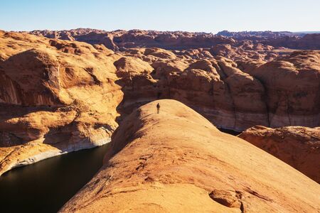 Hike in the Utah mountains. Hiking in unusual natural landscapes. Fantastic forms sandstone formations.の写真素材