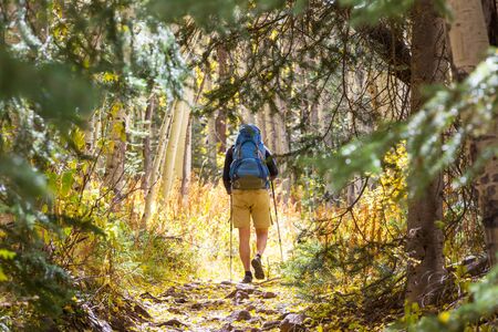 Hike in the autumn mountains. Fall season theme.