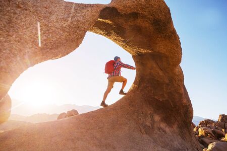 Hike in the Utah mountains. Hiking in unusual natural landscapes. Fantastic forms sandstone formations.の写真素材