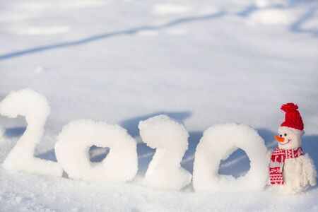Pretty Snowman on snowy New Year 2020  date backgroundの写真素材
