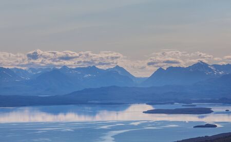 Picturesque Mountains of Alaska in summer. Snow covered massifs, glaciers and rocky peaks.