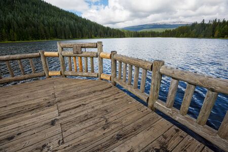 Serene beautiful lake in morning mountains, Oregon, USA.