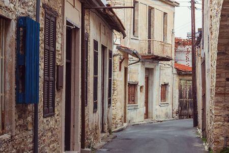 Flowers on  narrow street among the old housesの写真素材