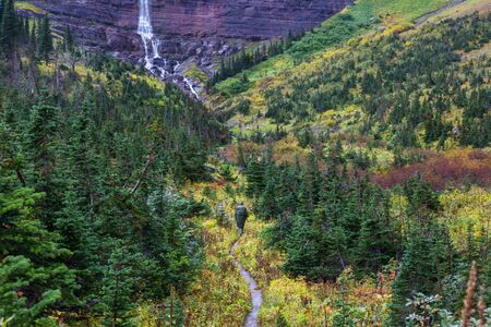 Hike in the autumn mountains. Fall season theme.