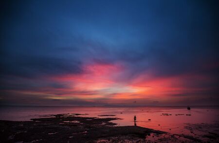 Scenic colorful sunset at the sea coast. Good for wallpaper or background image.の写真素材