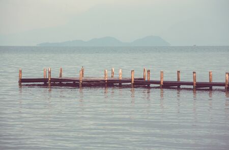 Wooden boardwalk on the tropical beachの写真素材