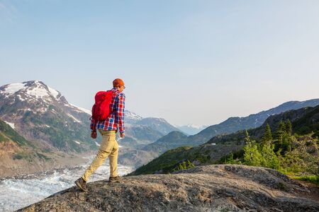 Hiking man in Canadian mountains. Hike is the popular recreation activity in North America. There are a lot of picturesque trails.の写真素材