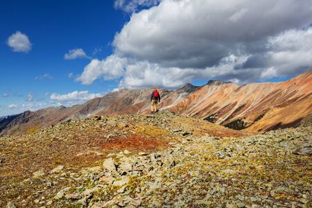 Man hiking in the Rocky mountains, Colorado in autumn seasonの写真素材