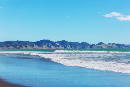 Beautiful Sunset at the Ocean Beach, New Zealand. Inspiring natural and travel backgroundの写真素材