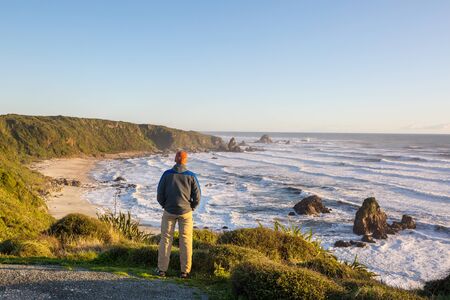 Beautiful Sunset at the Ocean Beach, New Zealand. Inspiring natural and travel background