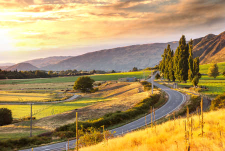 Landscape view of mountain valley at sunrise, New Zealandの写真素材