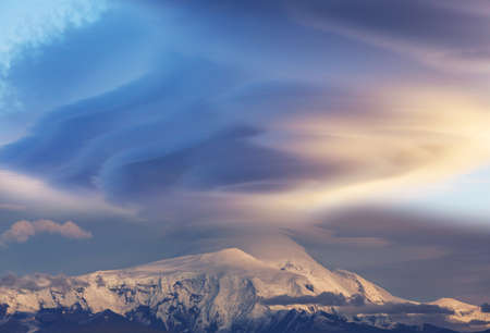 Unusual storm clouds over the mountain peak. Wrangell-St. Elias National Park and Preserve, Alaska.