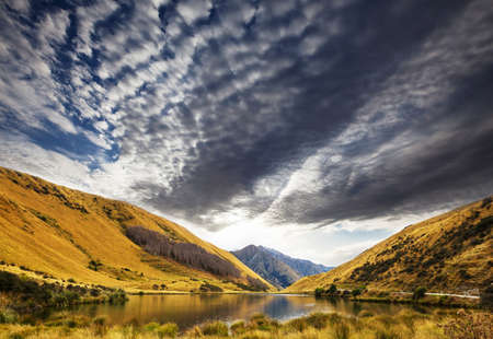 Amazing natural landscapes in New Zealand. Mountains lake at sunset.の写真素材